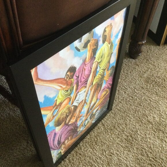 this is a canvas of effort football in a 20x30 black frame - Picture 5 of 8